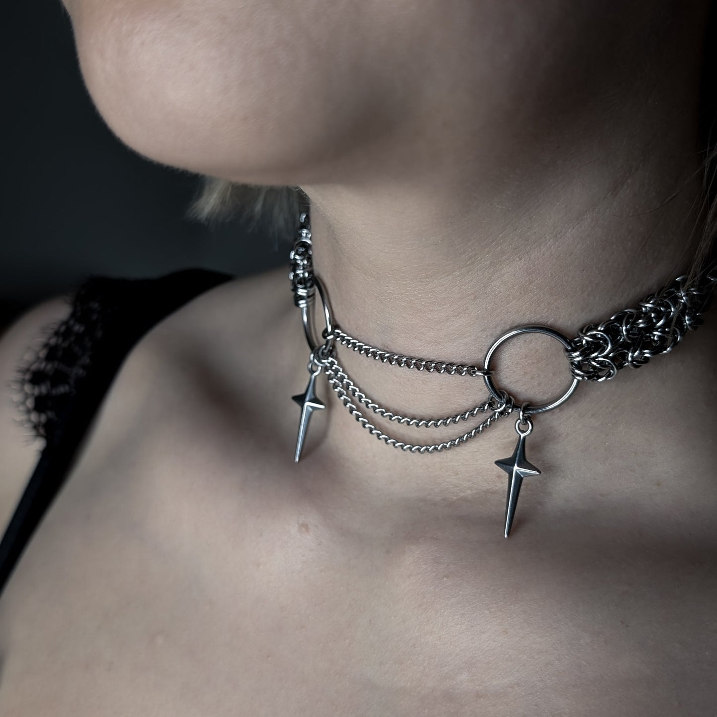 Stainless steel choker with hanging chains featuring two stars.