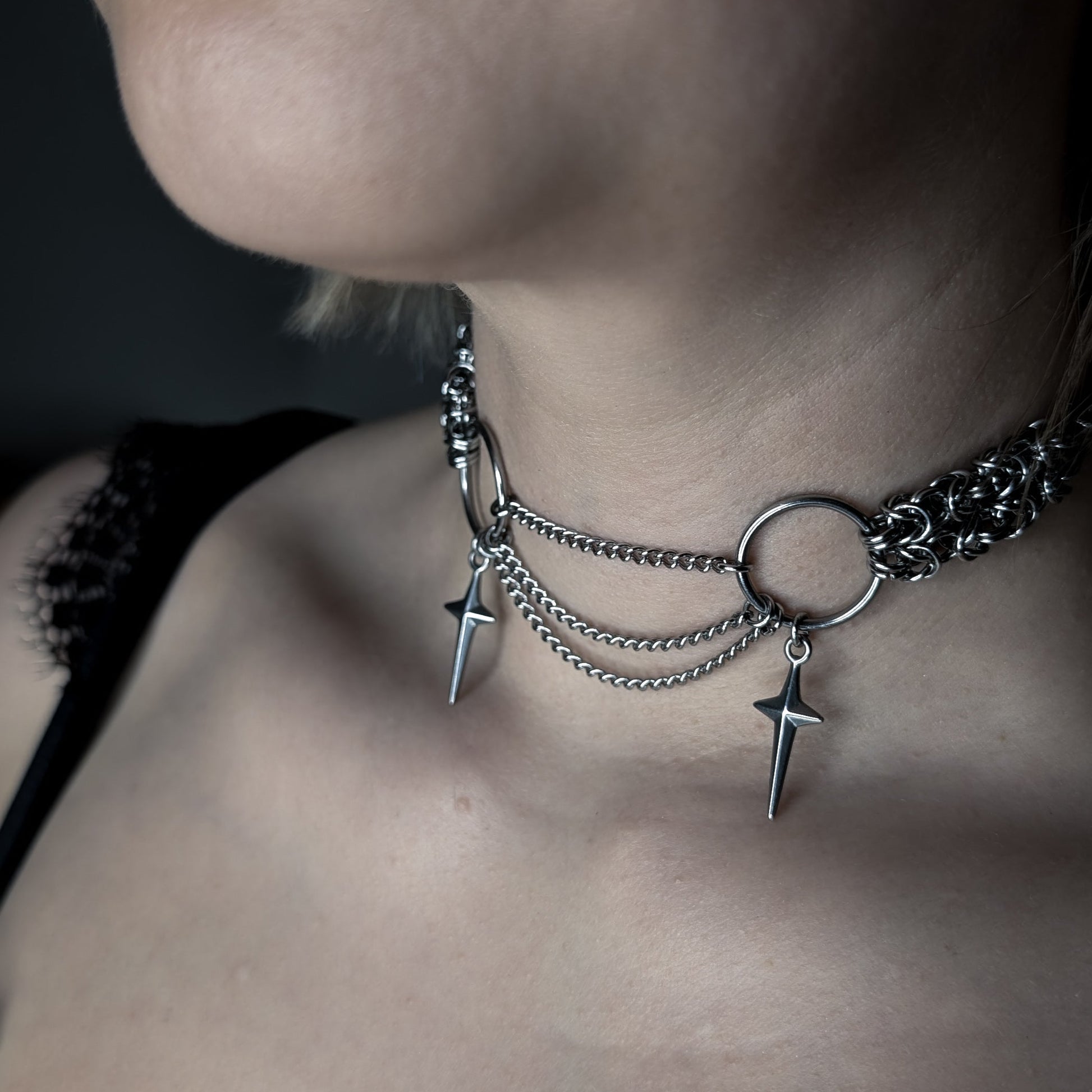 Stainless steel choker with hanging chains featuring two stars.